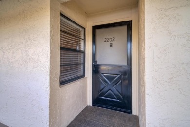 This is the best-priced unit in Villas de Golf and is available on Largo Golf Course in Florida - for sale on GolfHomes.com, golf home, golf lot
