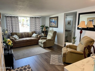 This is a beautifully 1993 updated unit (2019) that's located on on Fountain of the Sun Country Club in Arizona - for sale on GolfHomes.com, golf home, golf lot