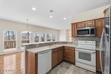 Come experience this immaculately maintained 4-bedroom, 3-bath on Toqua Golf Course - Loudon County in Tennessee - for sale on GolfHomes.com, golf home, golf lot