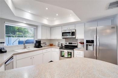 FULLY FURNISHED! Welcome to 8060 Canterbury Chase, Largo on Bayou Golf Club in Florida - for sale on GolfHomes.com, golf home, golf lot