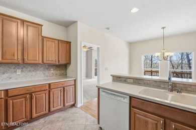 Come experience this immaculately maintained 4-bedroom, 3-bath on Toqua Golf Course - Loudon County in Tennessee - for sale on GolfHomes.com, golf home, golf lot