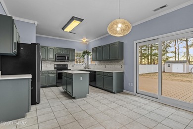 Bring the family to this spacious home featuring 6 bedrooms or 5 on Eagle Creek Golf Club and Grill in North Carolina - for sale on GolfHomes.com, golf home, golf lot