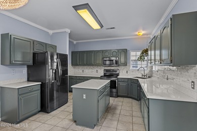 Bring the family to this spacious home featuring 6 bedrooms or 5 on Eagle Creek Golf Club and Grill in North Carolina - for sale on GolfHomes.com, golf home, golf lot