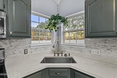 Bring the family to this spacious home featuring 6 bedrooms or 5 on Eagle Creek Golf Club and Grill in North Carolina - for sale on GolfHomes.com, golf home, golf lot