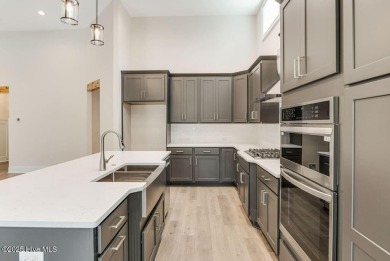 This brand new Riptide home with stunning setting and finishes on Sea Trail Golf Resort in North Carolina - for sale on GolfHomes.com, golf home, golf lot