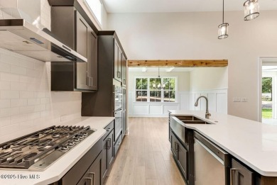 This brand new Riptide home with stunning setting and finishes on Sea Trail Golf Resort in North Carolina - for sale on GolfHomes.com, golf home, golf lot