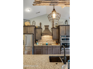 Located at the end of a quiet cul-de-sac in the prestigious golf on Brunswick Plantation and Golf Resorts in North Carolina - for sale on GolfHomes.com, golf home, golf lot