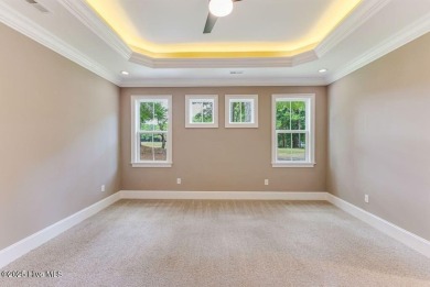This brand new Riptide home with stunning setting and finishes on Sea Trail Golf Resort in North Carolina - for sale on GolfHomes.com, golf home, golf lot
