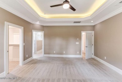 This brand new Riptide home with stunning setting and finishes on Sea Trail Golf Resort in North Carolina - for sale on GolfHomes.com, golf home, golf lot