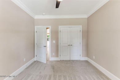 This brand new Riptide home with stunning setting and finishes on Sea Trail Golf Resort in North Carolina - for sale on GolfHomes.com, golf home, golf lot