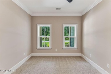This brand new Riptide home with stunning setting and finishes on Sea Trail Golf Resort in North Carolina - for sale on GolfHomes.com, golf home, golf lot