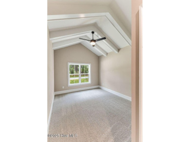 This brand new Riptide home with stunning setting and finishes on Sea Trail Golf Resort in North Carolina - for sale on GolfHomes.com, golf home, golf lot