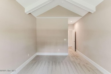 This brand new Riptide home with stunning setting and finishes on Sea Trail Golf Resort in North Carolina - for sale on GolfHomes.com, golf home, golf lot