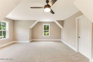 This brand new Riptide home with stunning setting and finishes on Sea Trail Golf Resort in North Carolina - for sale on GolfHomes.com, golf home, golf lot