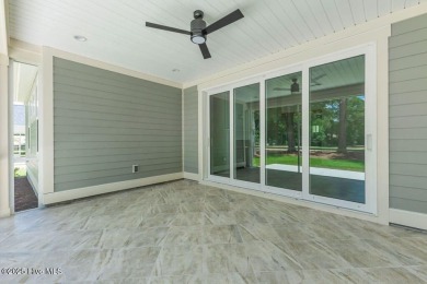 This brand new Riptide home with stunning setting and finishes on Sea Trail Golf Resort in North Carolina - for sale on GolfHomes.com, golf home, golf lot