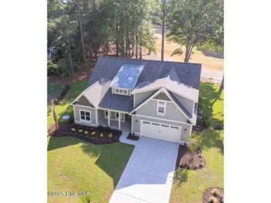 This brand new Riptide home with stunning setting and finishes on Sea Trail Golf Resort in North Carolina - for sale on GolfHomes.com, golf home, golf lot