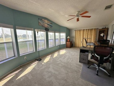 Located on a prime corner lot directly across from the clubhouse on Four Lakes Golf Club in Florida - for sale on GolfHomes.com, golf home, golf lot