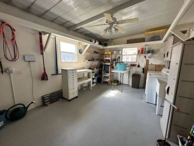 Located on a prime corner lot directly across from the clubhouse on Four Lakes Golf Club in Florida - for sale on GolfHomes.com, golf home, golf lot