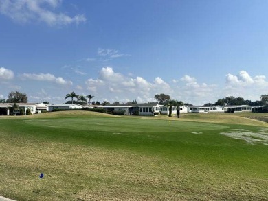 Located on a prime corner lot directly across from the clubhouse on Four Lakes Golf Club in Florida - for sale on GolfHomes.com, golf home, golf lot