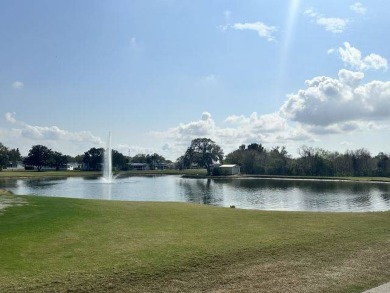 Located on a prime corner lot directly across from the clubhouse on Four Lakes Golf Club in Florida - for sale on GolfHomes.com, golf home, golf lot