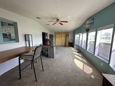 Located on a prime corner lot directly across from the clubhouse on Four Lakes Golf Club in Florida - for sale on GolfHomes.com, golf home, golf lot
