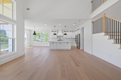 THIS GORGEOUS NEW CONSTRUCTION IS DIRECTLY ON OSPREY POINTE POND on Harbor Club Golf and Country Club in Georgia - for sale on GolfHomes.com, golf home, golf lot