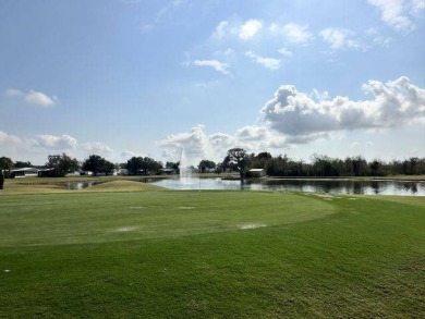 Located on a prime corner lot directly across from the clubhouse on Four Lakes Golf Club in Florida - for sale on GolfHomes.com, golf home, golf lot