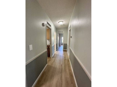 Located on a prime corner lot directly across from the clubhouse on Four Lakes Golf Club in Florida - for sale on GolfHomes.com, golf home, golf lot