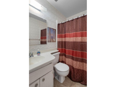Welcome to this 2-bedroom, 2-bath home located in the highly on Falcon Watch Golf Club in Florida - for sale on GolfHomes.com, golf home, golf lot