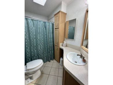 Located on a prime corner lot directly across from the clubhouse on Four Lakes Golf Club in Florida - for sale on GolfHomes.com, golf home, golf lot