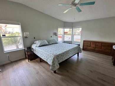 Located on a prime corner lot directly across from the clubhouse on Four Lakes Golf Club in Florida - for sale on GolfHomes.com, golf home, golf lot