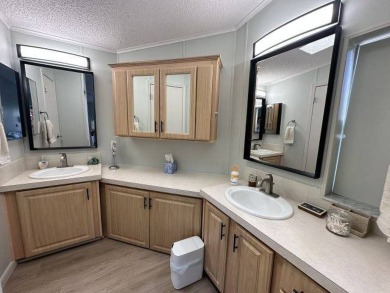 Located on a prime corner lot directly across from the clubhouse on Four Lakes Golf Club in Florida - for sale on GolfHomes.com, golf home, golf lot