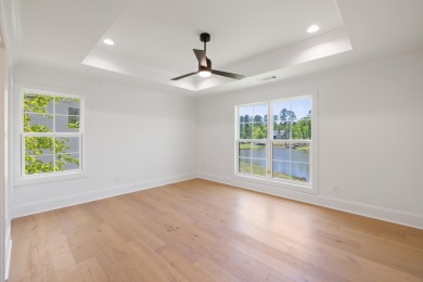 THIS GORGEOUS NEW CONSTRUCTION IS DIRECTLY ON OSPREY POINTE POND on Harbor Club Golf and Country Club in Georgia - for sale on GolfHomes.com, golf home, golf lot