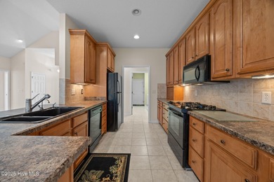 Welcome to **8887 Lansdowne Drive**, a beautiful home in the on Brunswick Plantation and Golf Resorts in North Carolina - for sale on GolfHomes.com, golf home, golf lot