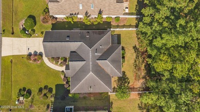 Welcome to **8887 Lansdowne Drive**, a beautiful home in the on Brunswick Plantation and Golf Resorts in North Carolina - for sale on GolfHomes.com, golf home, golf lot