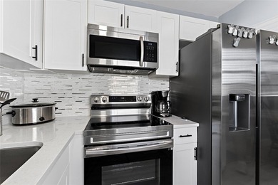 First-floor condo in Beautiful Vista Royale - a MUST SEE! This on The American Golf Club in Florida - for sale on GolfHomes.com, golf home, golf lot