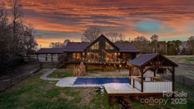 Tucked away in Maiden, this charming log cabin home sits on 1.41 on Glen Oaks Golf and Country Club in North Carolina - for sale on GolfHomes.com, golf home, golf lot