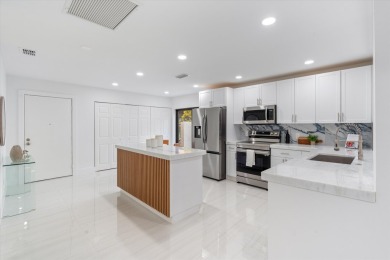 Recently updated and remodeled villa on the lake in Boca Lagoe on Boca Lago Golf and Country Club in Florida - for sale on GolfHomes.com, golf home, golf lot