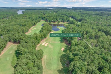 Located on the 6th fairway of the renowned National Golf Course on Reynolds Lake Oconee - The Oconee in Georgia - for sale on GolfHomes.com, golf home, golf lot
