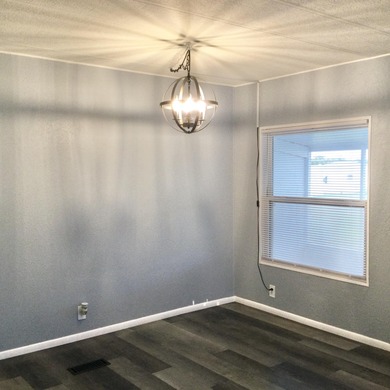 Meticulously restored home with state of the art kitchen.  This on Spanish Lakes I in Florida - for sale on GolfHomes.com, golf home, golf lot