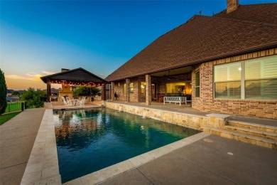 Stunning one story custom home that sits on the canal in The on The Golf Club at Resort Eagle Mountain Lake in Texas - for sale on GolfHomes.com, golf home, golf lot