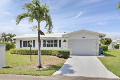 This charming 2-bedroom, 2-bathroom home in Palm Beach on Leisureville Community Golf Course in Florida - for sale on GolfHomes.com, golf home, golf lot