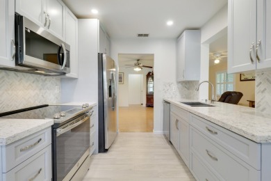 This charming 2-bedroom, 2-bathroom home in Palm Beach on Leisureville Community Golf Course in Florida - for sale on GolfHomes.com, golf home, golf lot