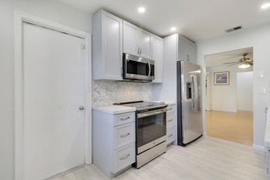 This charming 2-bedroom, 2-bathroom home in Palm Beach on Leisureville Community Golf Course in Florida - for sale on GolfHomes.com, golf home, golf lot