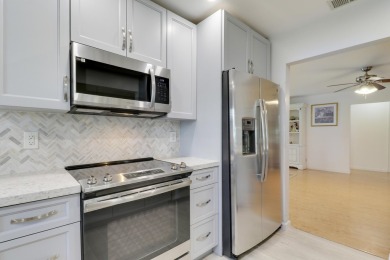 This charming 2-bedroom, 2-bathroom home in Palm Beach on Leisureville Community Golf Course in Florida - for sale on GolfHomes.com, golf home, golf lot