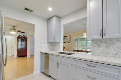 This charming 2-bedroom, 2-bathroom home in Palm Beach on Leisureville Community Golf Course in Florida - for sale on GolfHomes.com, golf home, golf lot