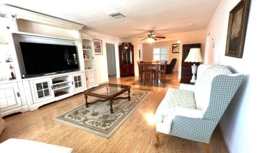 This charming 2-bedroom, 2-bathroom home in Palm Beach on Leisureville Community Golf Course in Florida - for sale on GolfHomes.com, golf home, golf lot
