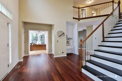 From the moment you arrive, the wrap-around porch invites you to on White Deer Run Golf Club in Illinois - for sale on GolfHomes.com, golf home, golf lot