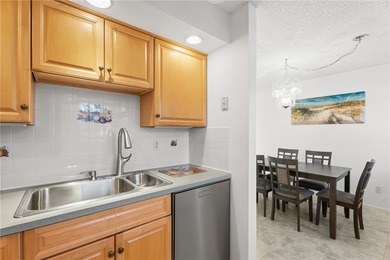 Turnkey 2BR/2BA corner condo in Vista Royale, a desirable 55+ on The American Golf Club in Florida - for sale on GolfHomes.com, golf home, golf lot