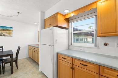 Turnkey 2BR/2BA corner condo in Vista Royale, a desirable 55+ on The American Golf Club in Florida - for sale on GolfHomes.com, golf home, golf lot